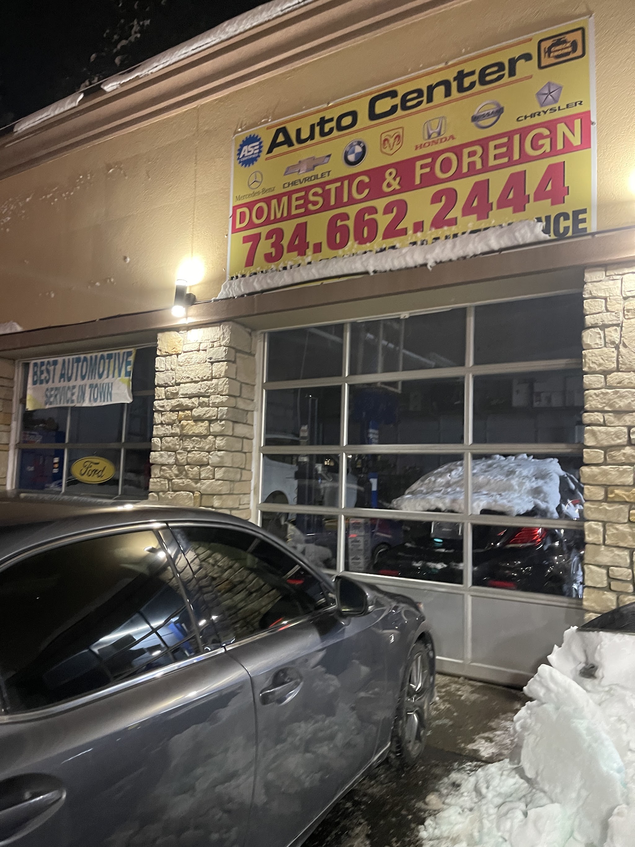 North Side Auto shop exterior at night